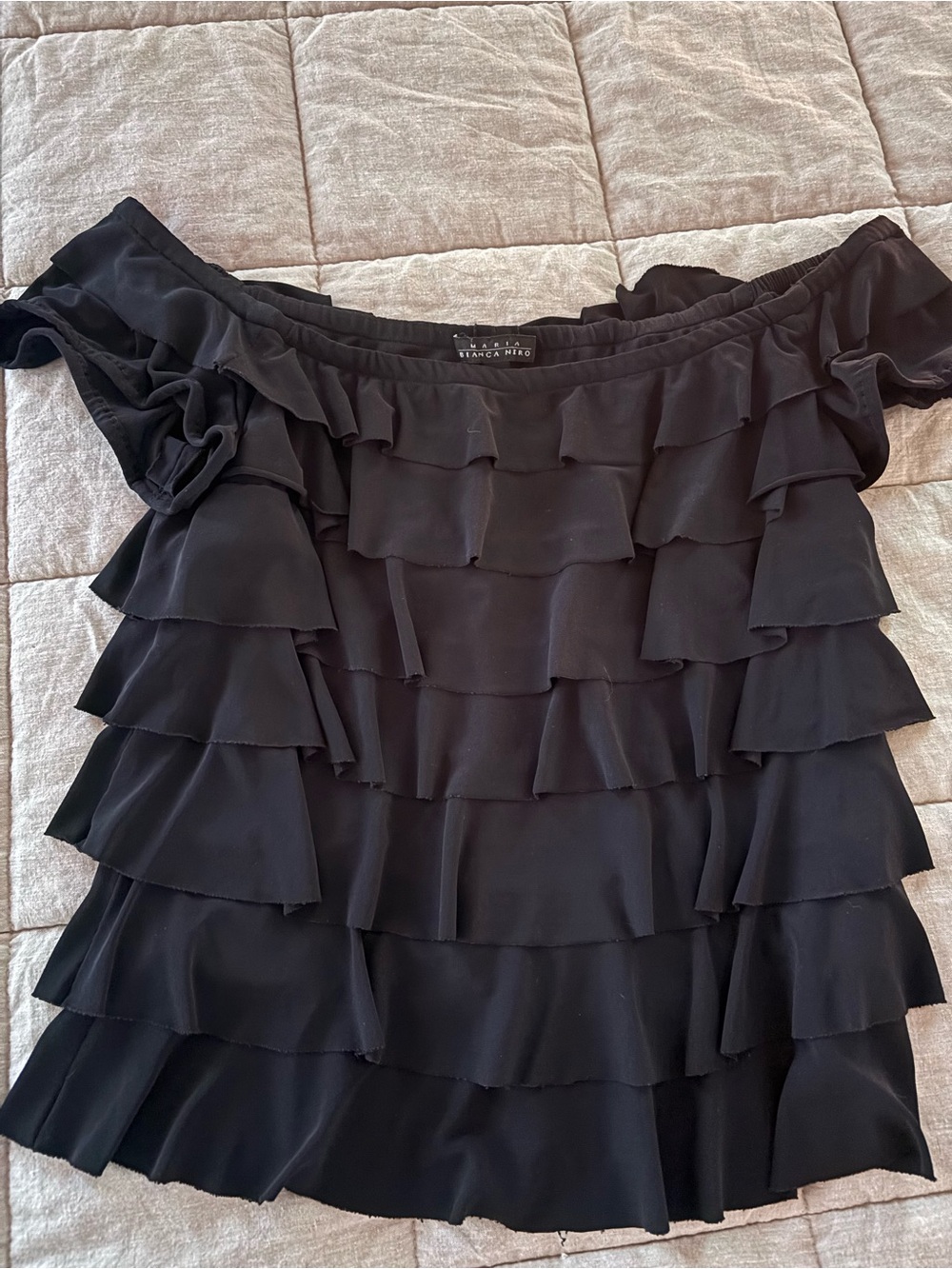 Ruffled black top